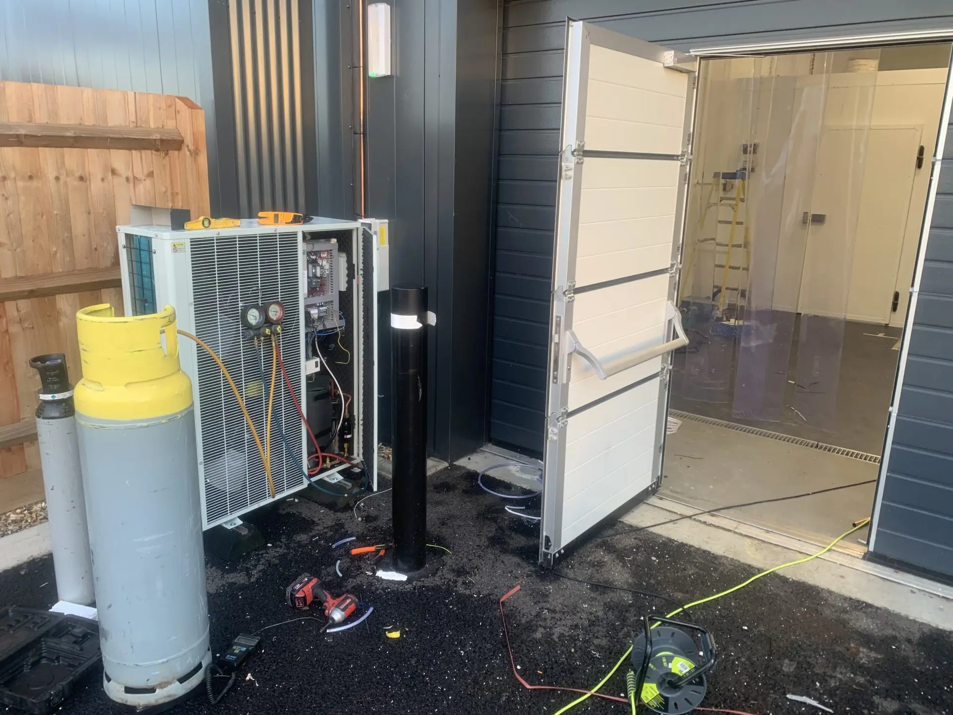 Engineers installing cold storage equipment